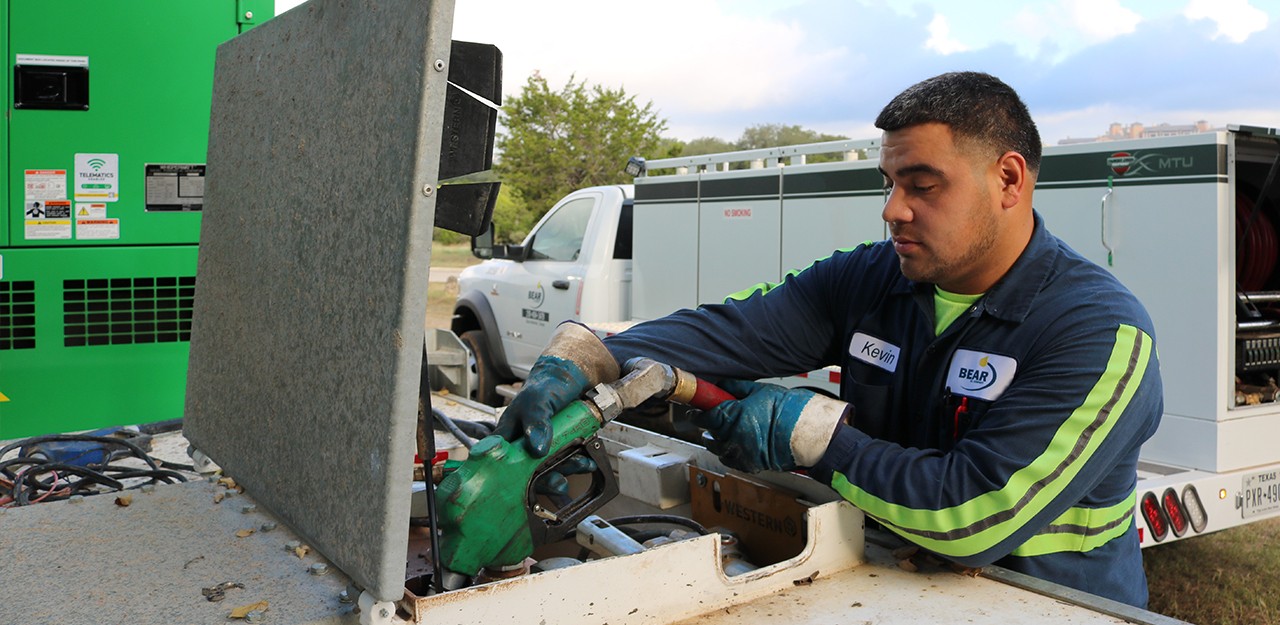 Bear Oil Employee with diesel pump