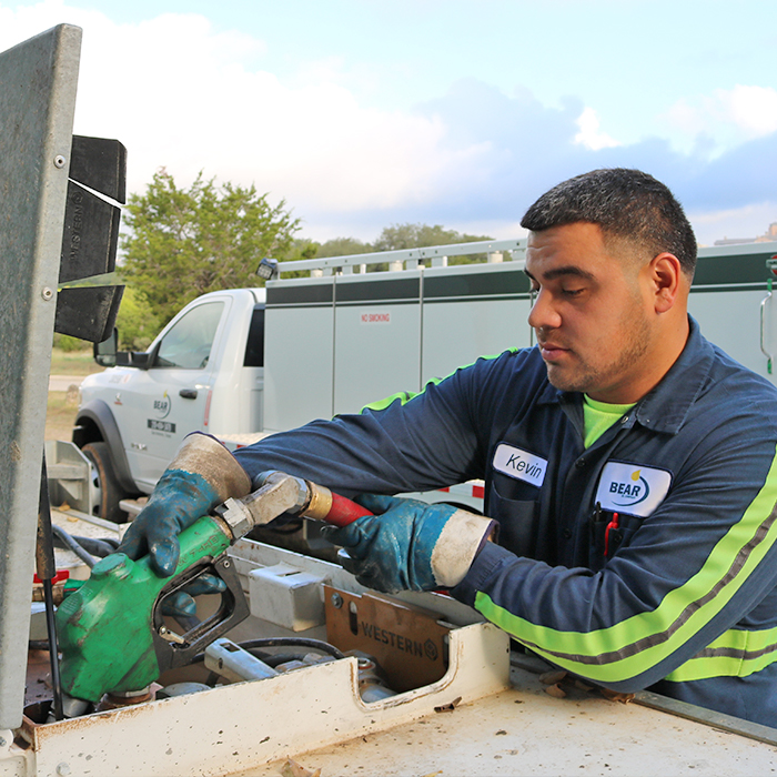 Man delivering fuel to generator