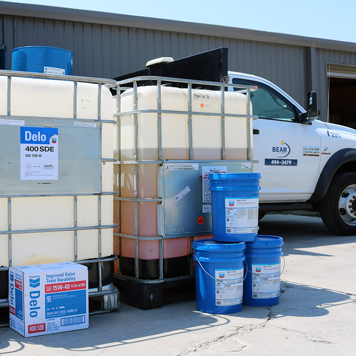 Lubricants in front of Bear Oil vehicle