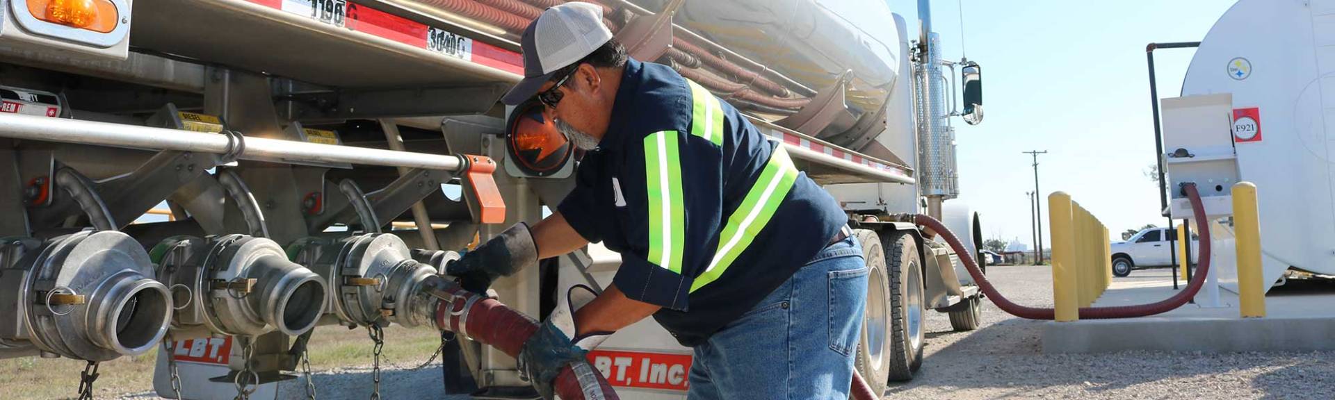 Bear Oil delivering fuel to equipment tank